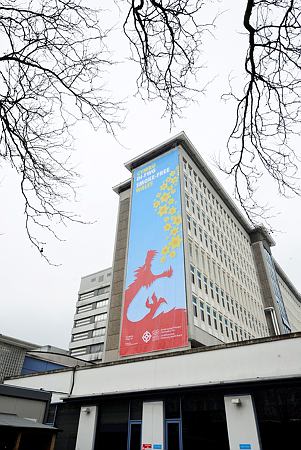 The sign which covers the height of the University Hospital Wales, Cardiff