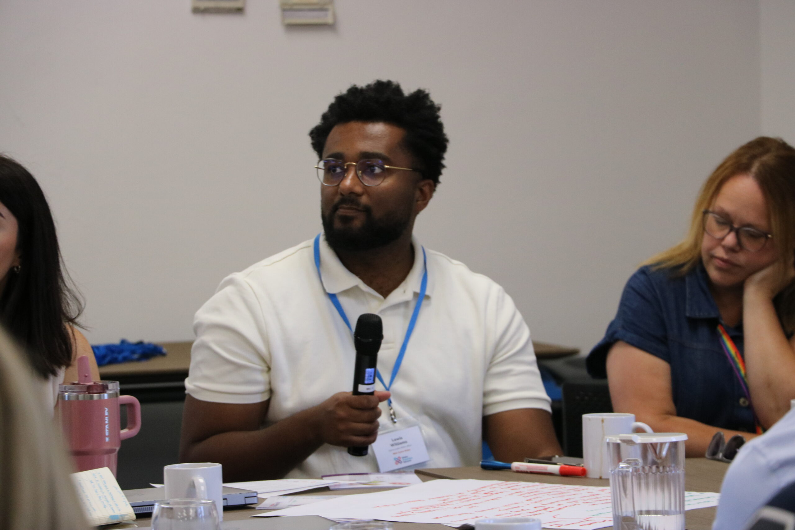 Participant speaking during a Wales Prevention Network discussion in July 2026